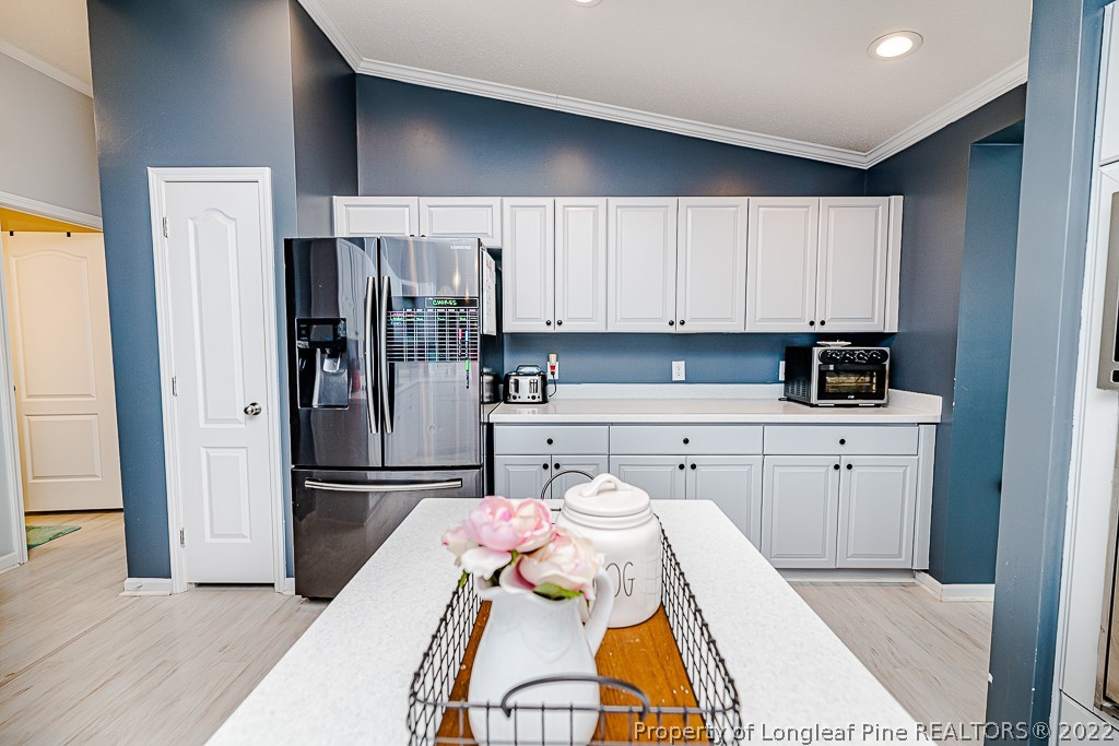 80 Ridge View Drive Cameron, NC 28326 - Photo 25 of 46 a kitchen with a refrigerator and white cabinets