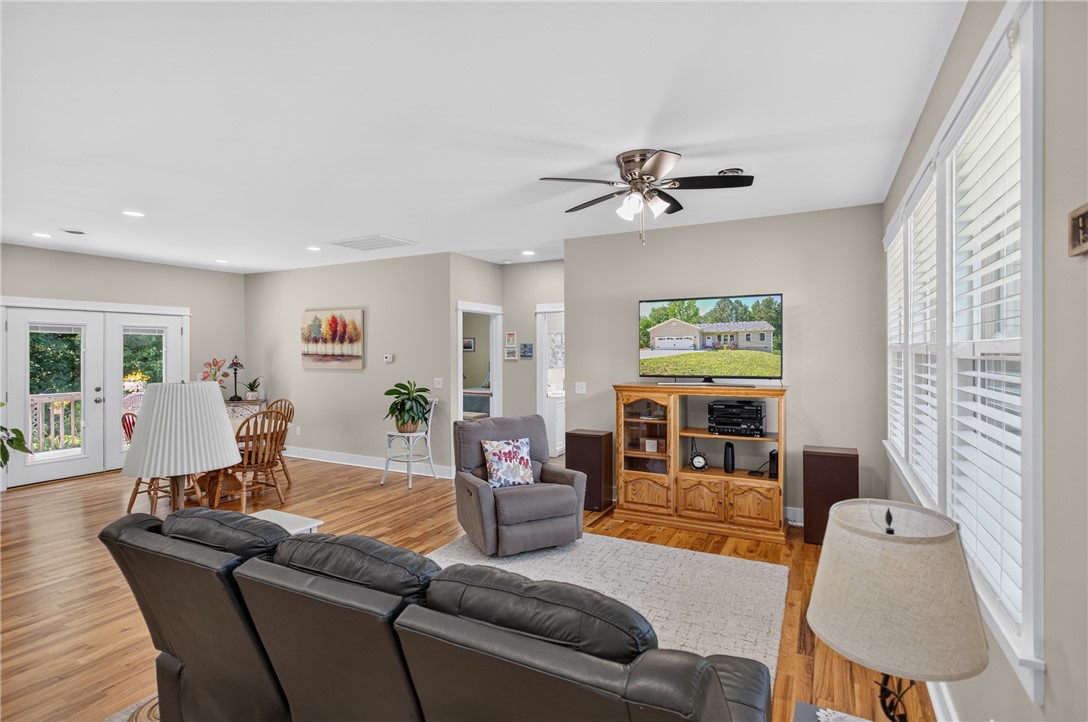 405 Pawnee Drive Walhalla, SC 29691 - Photo 6 of 36 Bright hardwood floors and abundant natural light illuminate this comfortable living space.