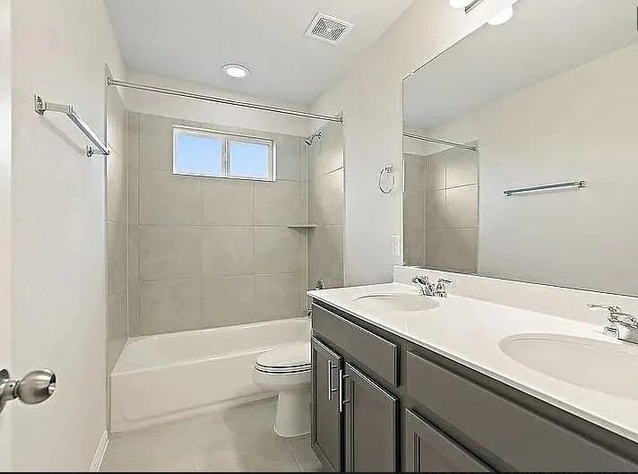10801 Sentinel Drive Austin, TX 78747 - Photo 11 of 23 a bathroom with a sink a toilet and shower
