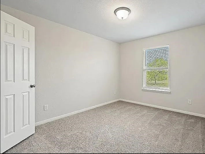10801 Sentinel Drive Austin, TX 78747 - Photo 13 of 23 an empty room with windows