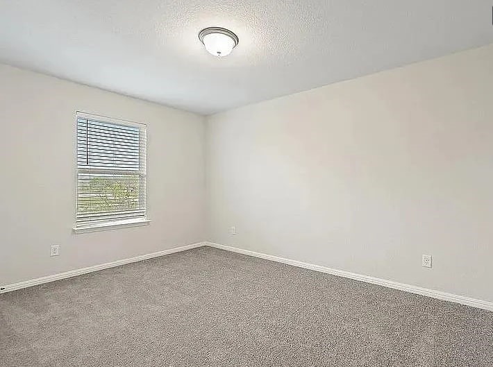 10801 Sentinel Drive Austin, TX 78747 - Photo 19 of 23 an empty room with a window