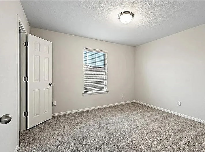 10801 Sentinel Drive Austin, TX 78747 - Photo 10 of 23 an empty room with a window