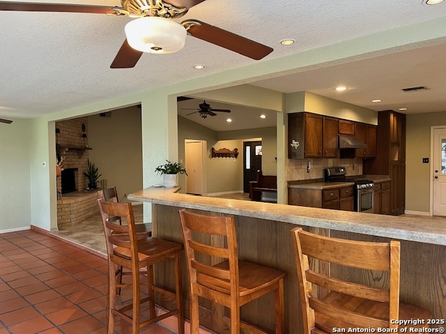 1216 Mocking Bird Circle Pleasanton, TX 78064 - Photo 11 of 31 a large kitchen with a table and chairs