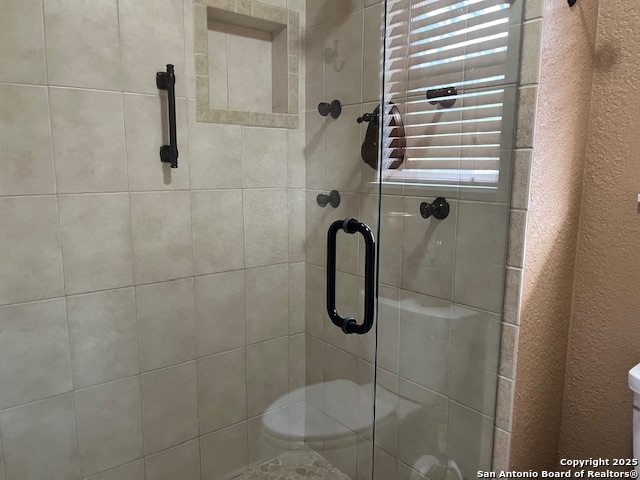 1216 Mocking Bird Circle Pleasanton, TX 78064 - Photo 18 of 31 a bathroom with a shower