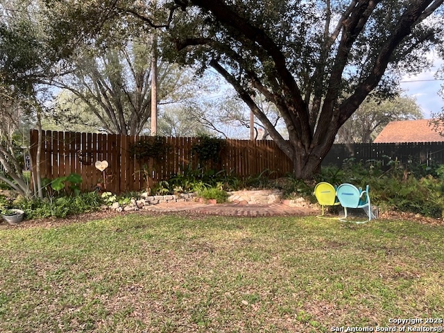 1216 Mocking Bird Circle Pleasanton, TX 78064 - Photo 28 of 31 a backyard of a house with table and chairs