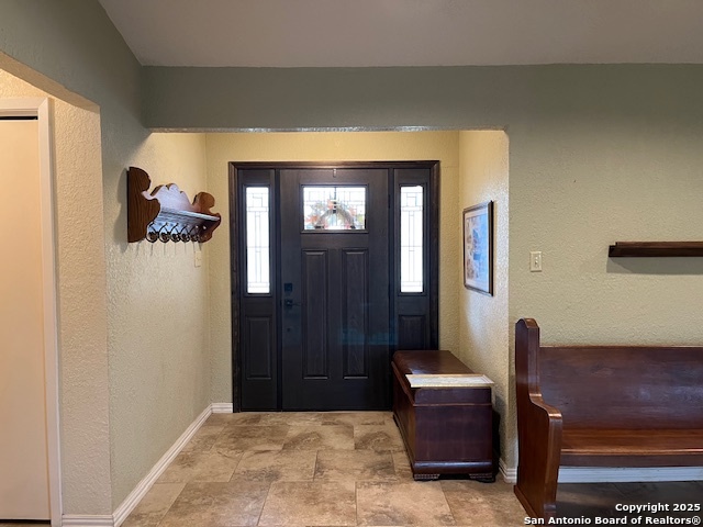 1216 Mocking Bird Circle Pleasanton, TX 78064 - Photo 4 of 31 a living room with furniture and a gate