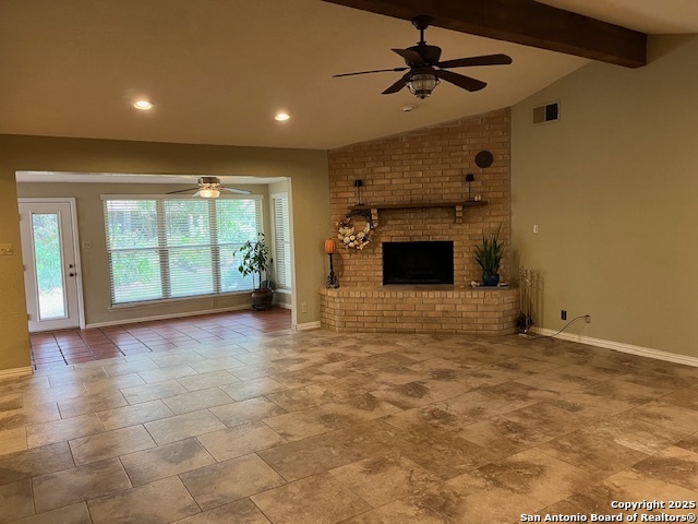 1216 Mocking Bird Circle Pleasanton, TX 78064 - Photo 8 of 31 a view of an empty room with a fireplace and a window