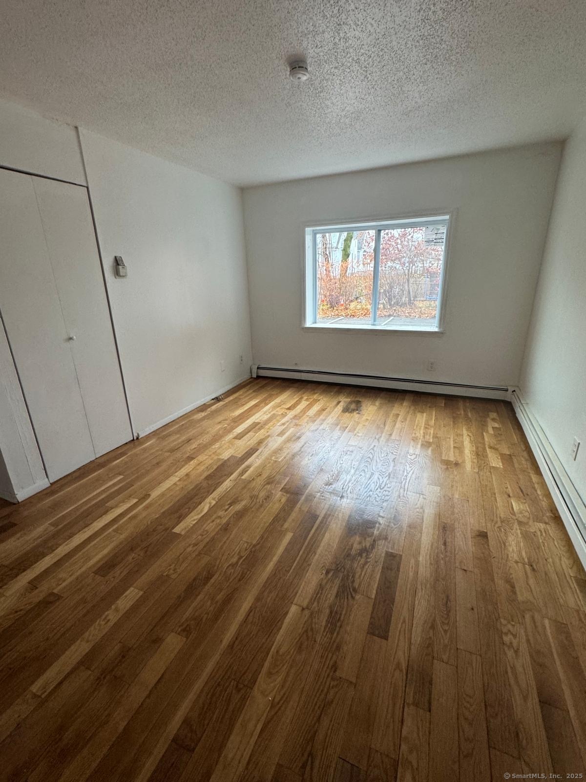 404 Charles Street, Unit C4 Bridgeport, CT 06606 - Photo 2 of 3 a view of an empty room and window