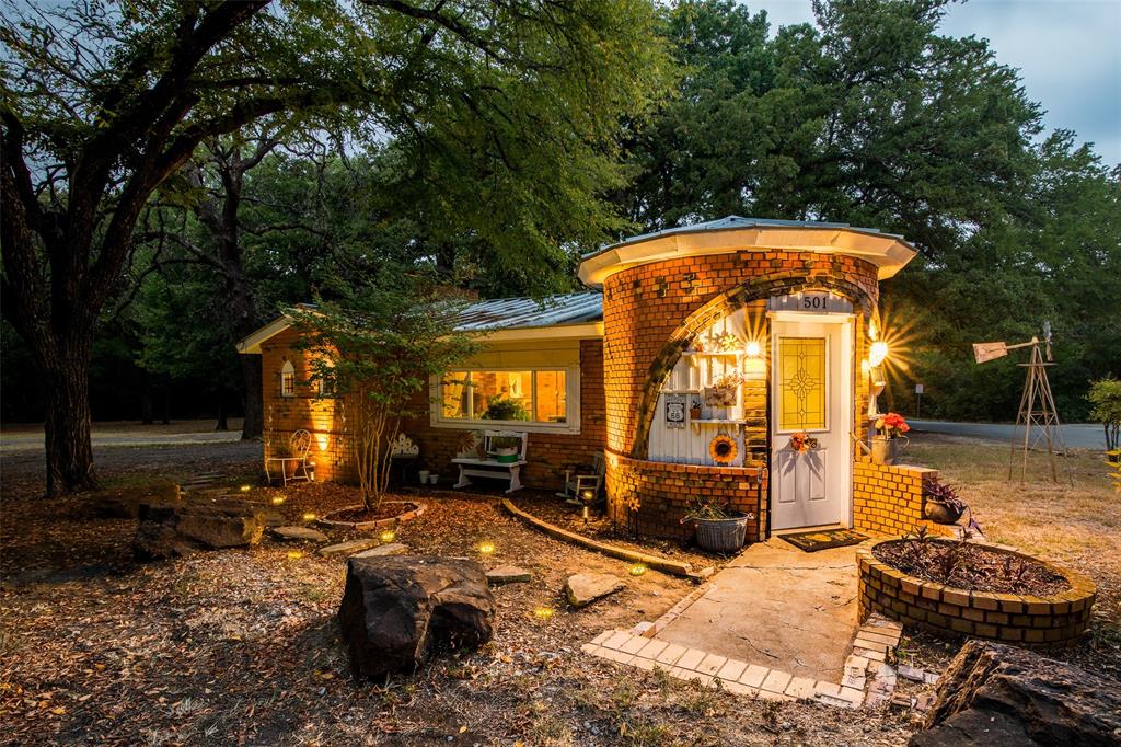 501 Lakeshore Road Shady Shores, TX 76208 - Photo 1 of 1 a view of a house with backyard water fountain and sitting area
