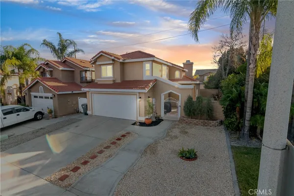 a view of multiple houses with a street