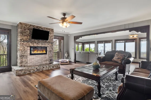 a living room with furniture fireplace and a flat screen tv
