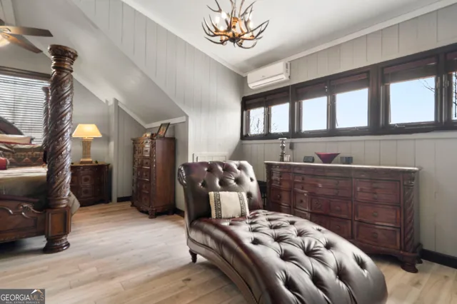 a bedroom with furniture and window