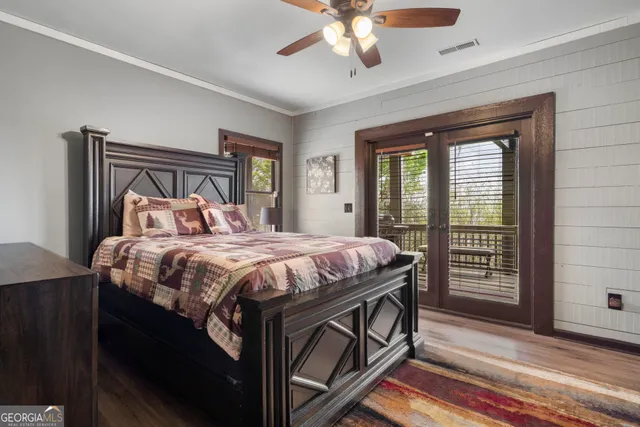 a bedroom with a large bed and a window