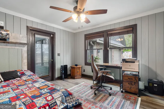 a bedroom that has a bed and a table in it