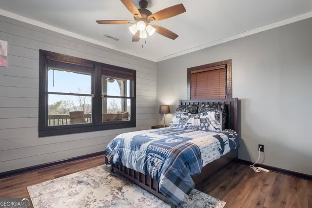 a bedroom with a large bed and a window