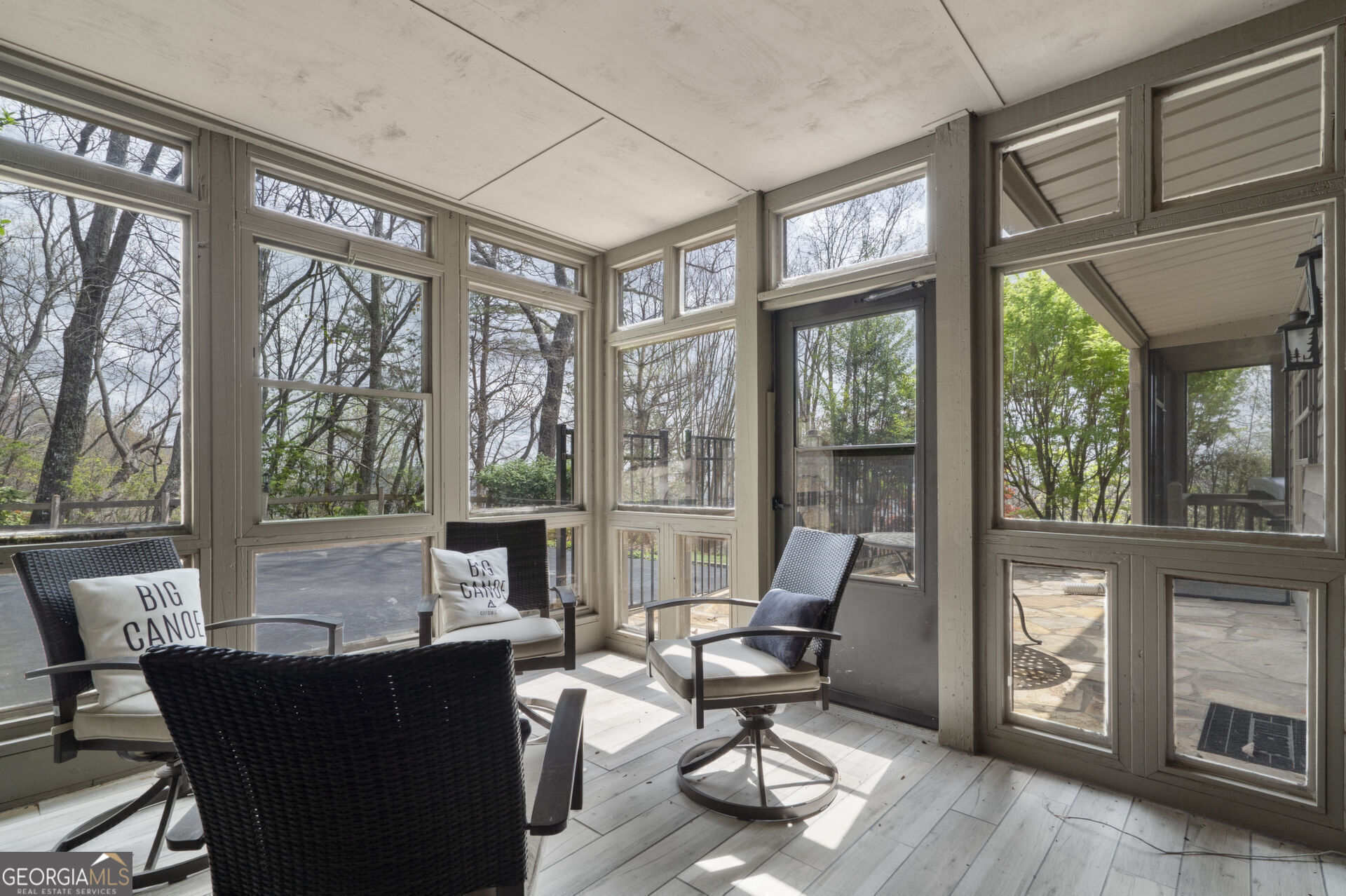 1545 Dawson Petit Rdg Drive Big Canoe, GA 30143 - Photo 28 of 36 a living room with furniture a floor to ceiling window and wooden floor