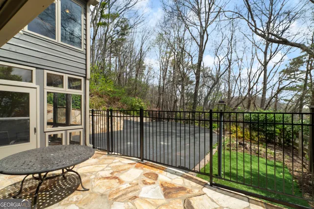 a view of a balcony and yard