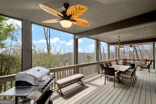 a view of a chairs and table in patio