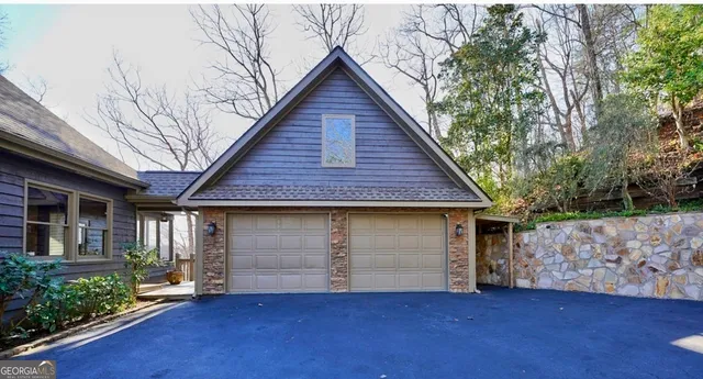 a front view of a house with garage