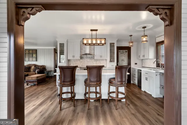 a view of a dining room with furniture and wooden floor