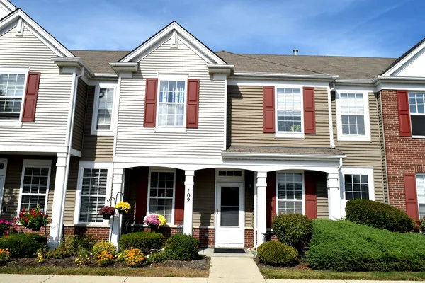 a front view of a house with garden