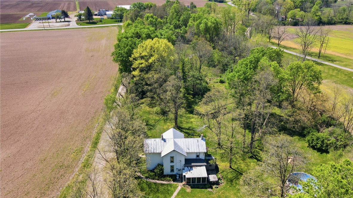 1444 Eagle City Road Springfield, OH 45504 - Photo 2 of 50 This tranquil rural property offers vast open spaces, lush trees, and an inviting home.