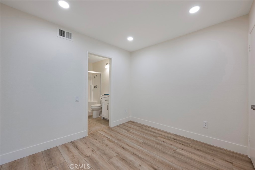598 Elkwood Court Brea, CA 92821 - Photo 13 of 32 a view of empty room with wooden floor