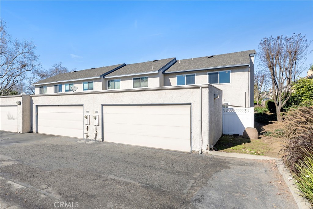 598 Elkwood Court Brea, CA 92821 - Photo 24 of 32 a front view of a house with a yard and garage