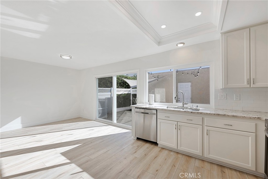 598 Elkwood Court Brea, CA 92821 - Photo 3 of 32 a spacious bathroom with a granite countertop sink and a mirror