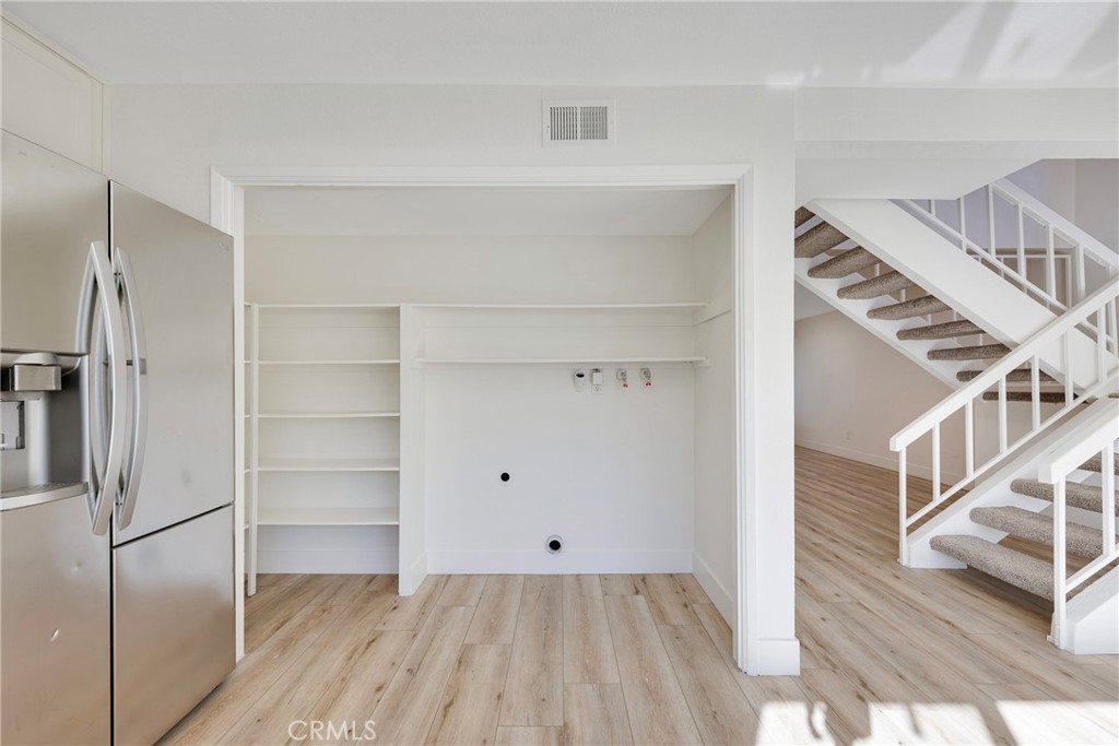 598 Elkwood Court Brea, CA 92821 - Photo 6 of 32 a view of an empty room with wooden floor and entryway
