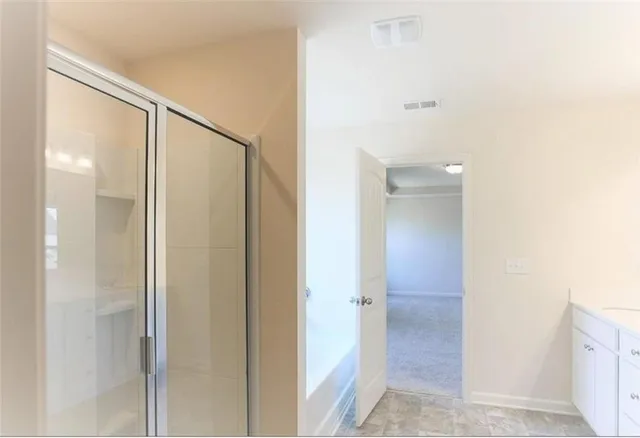 a view of a bathroom from the hallway