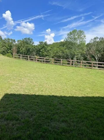 a view of a lake with a big yard