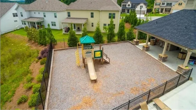 an aerial view of a house with a swimming pool