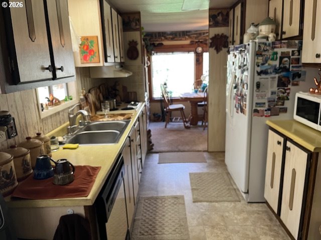 59099 Upper Imnaha Road Imnaha, OR 97842 - Photo 12 of 18 a kitchen that has a sink and a stove