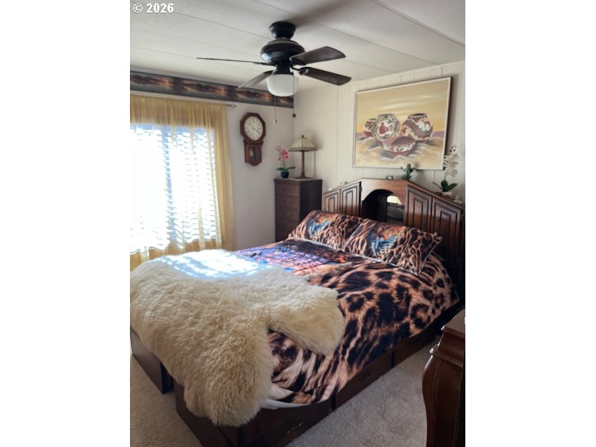 59099 Upper Imnaha Road Imnaha, OR 97842 - Photo 16 of 18 a bed sitting in a bedroom next to a window