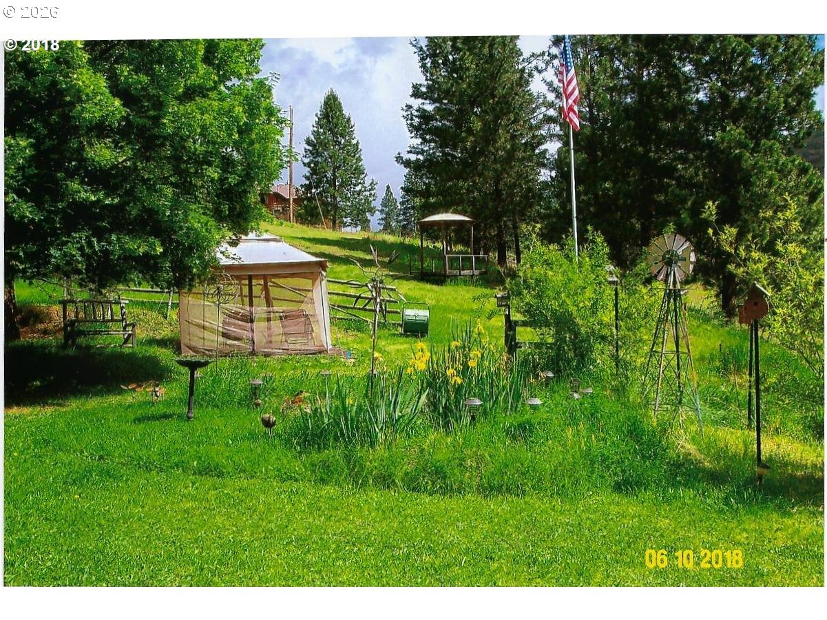 59099 Upper Imnaha Road Imnaha, OR 97842 - Photo 5 of 18 a view of a house with a backyard