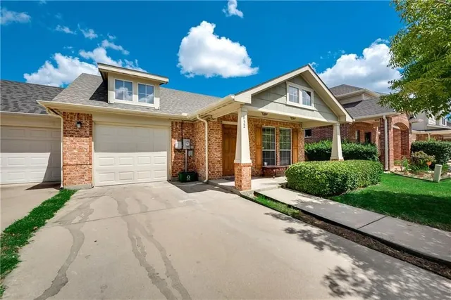 a front view of a house with yard