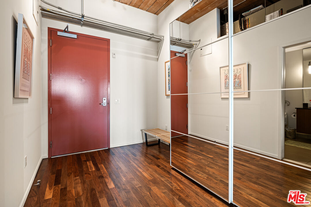 530 South Hewitt Street, Unit 425 Los Angeles, CA 90013 - Photo 12 of 22 a view of walk in closet with wooden floor