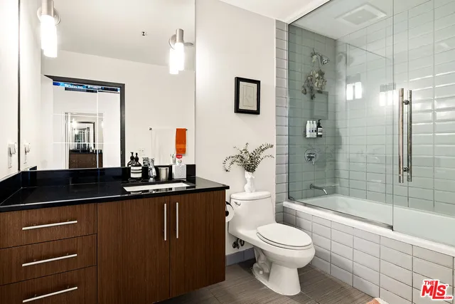 a view of a swimming pool with outdoor seating