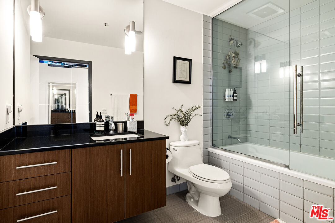 530 South Hewitt Street, Unit 425 Los Angeles, CA 90013 - Photo 13 of 22 a bathroom with a sink a toilet and shower
