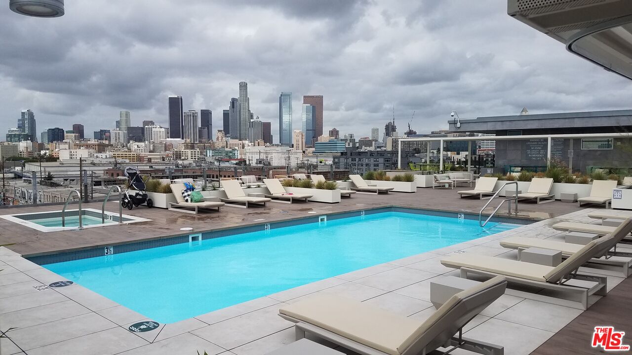 530 South Hewitt Street, Unit 425 Los Angeles, CA 90013 - Photo 14 of 22 a view of a swimming pool with outdoor seating