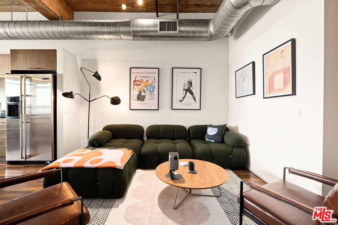 530 South Hewitt Street, Unit 425 Los Angeles, CA 90013 - Photo 10 of 22 a living room with furniture and a table