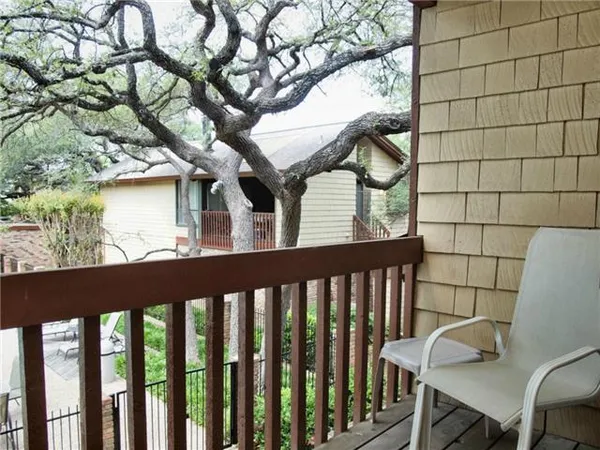 a view of balcony with a tree