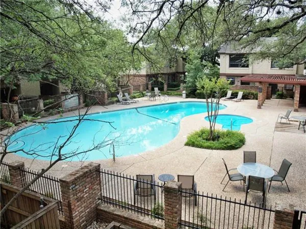 a view of a backyard with sitting area