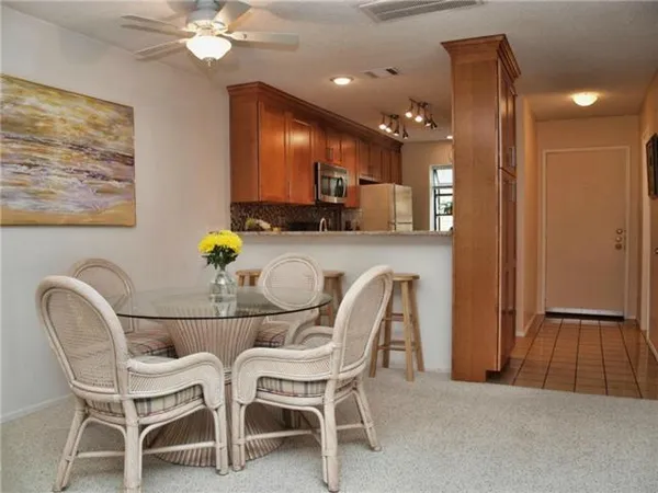a dining room with furniture and chandelier