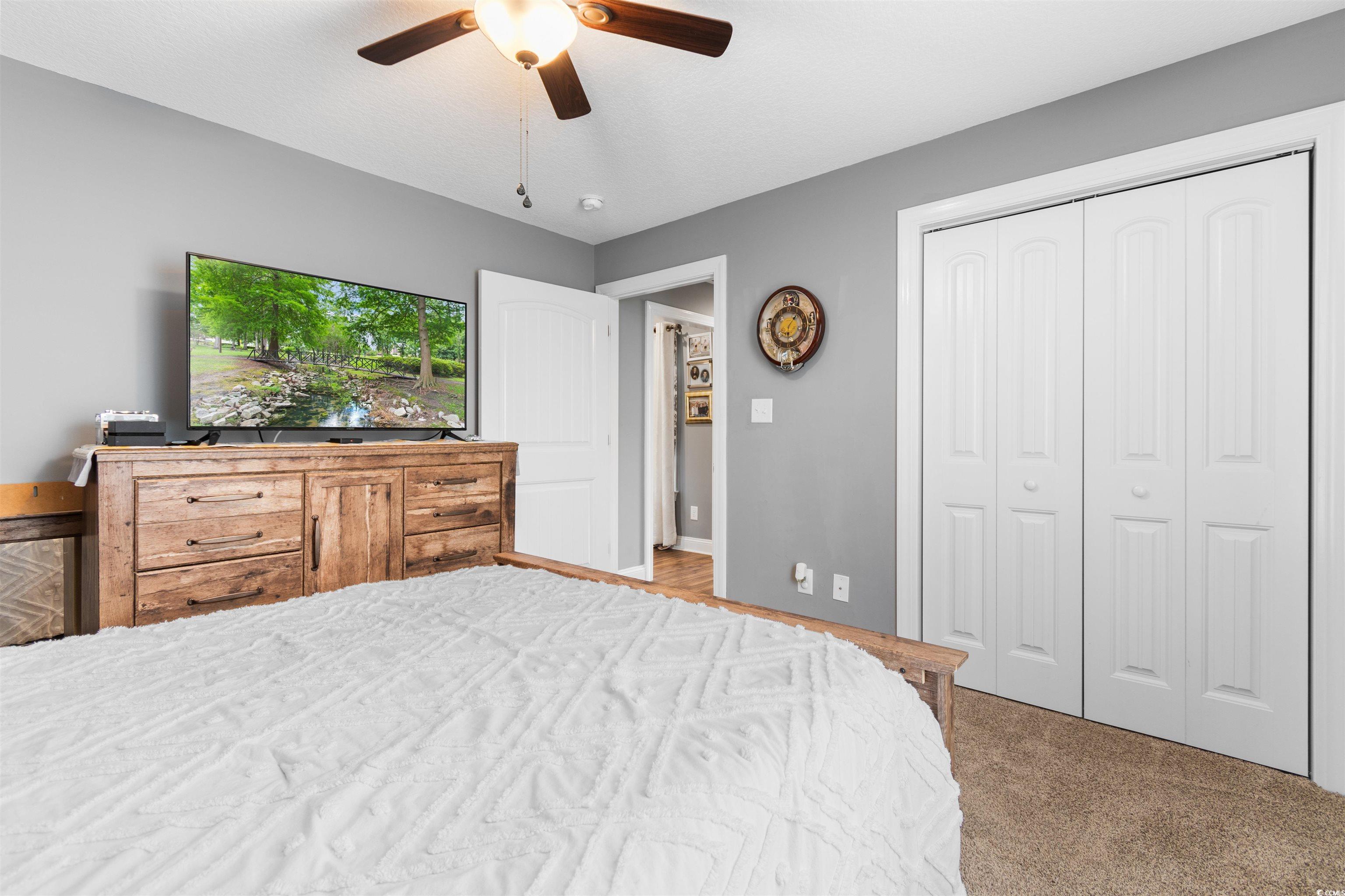 1896 Bud Graham Road Galivants Ferry, SC 29544 - Photo 25 of 36 Carpeted bedroom featuring ceiling fan and a close
