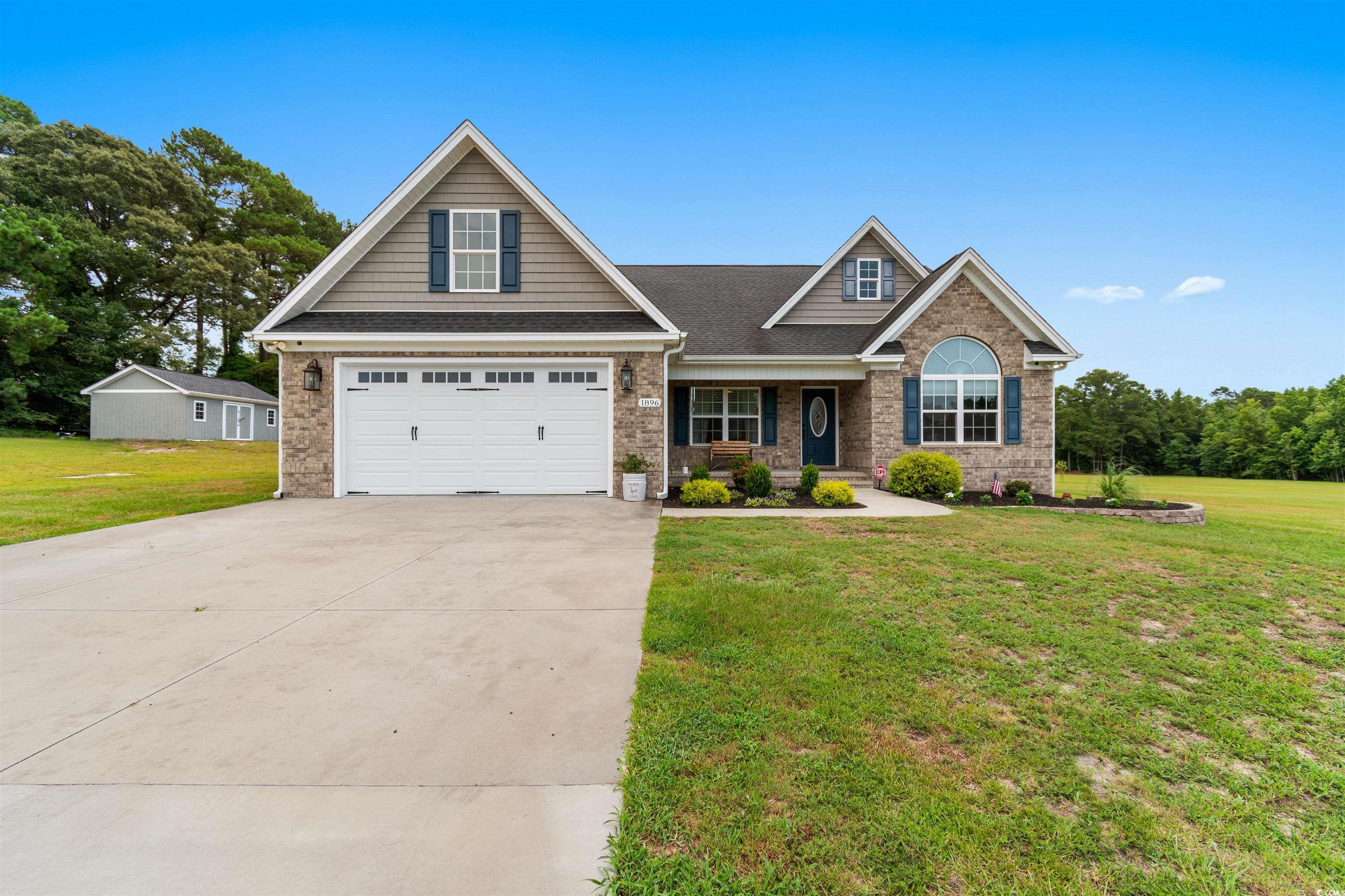 1896 Bud Graham Road Galivants Ferry, SC 29544 - Photo 3 of 36 Craftsman-style home with a garage and a front yar