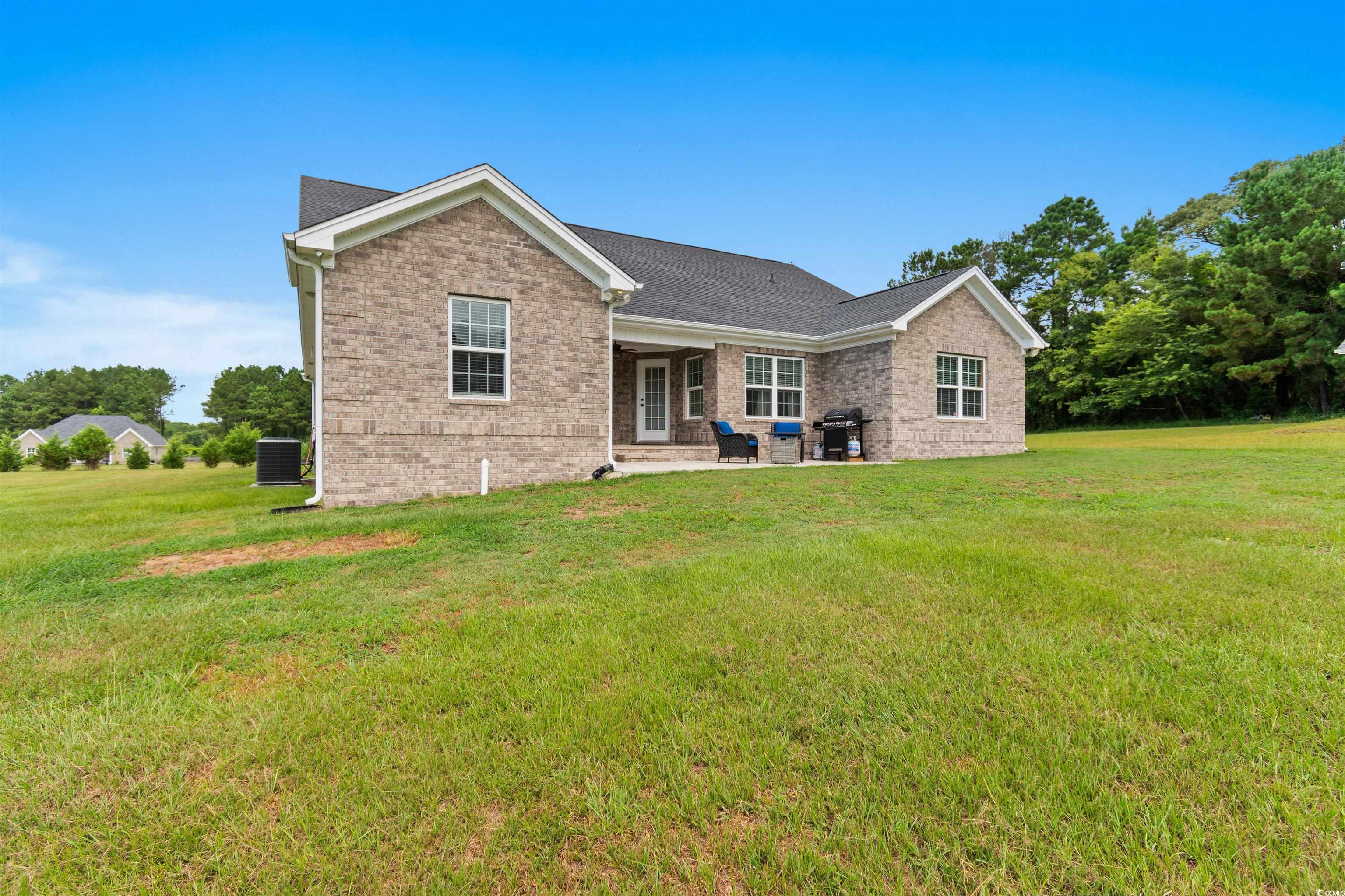 1896 Bud Graham Road Galivants Ferry, SC 29544 - Photo 31 of 36 Rear view of house with a patio area, central AC u