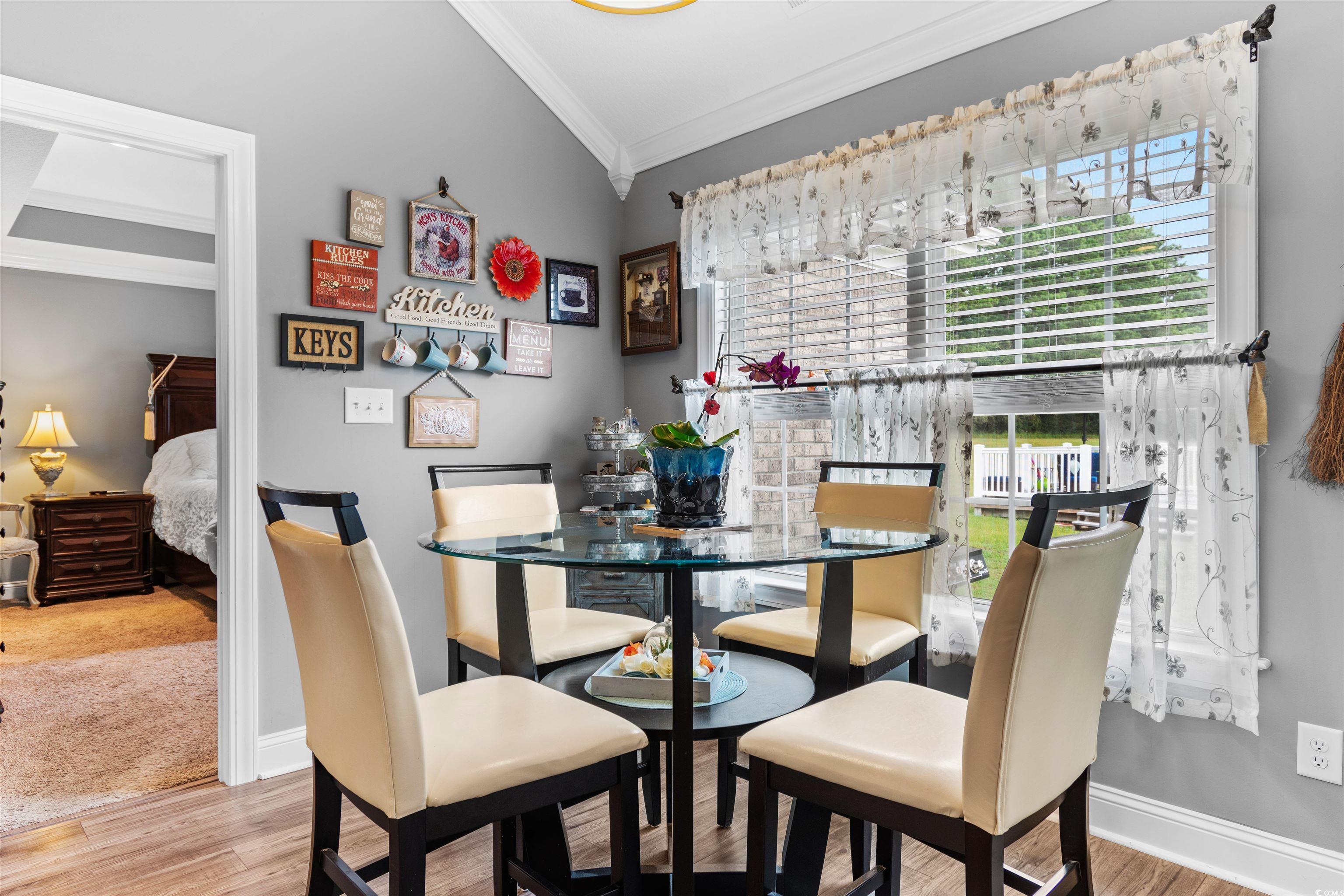 1896 Bud Graham Road Galivants Ferry, SC 29544 - Photo 10 of 36 Dining room with wood-type flooring, crown molding