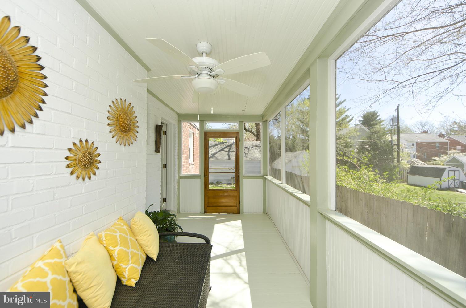 5700 25th Road North Arlington, VA 22207 - Photo 12 of 29 a spacious bedroom with a large bed and a chandelier